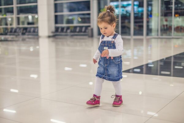 Toddler walking in terminal before Long Haul Flights