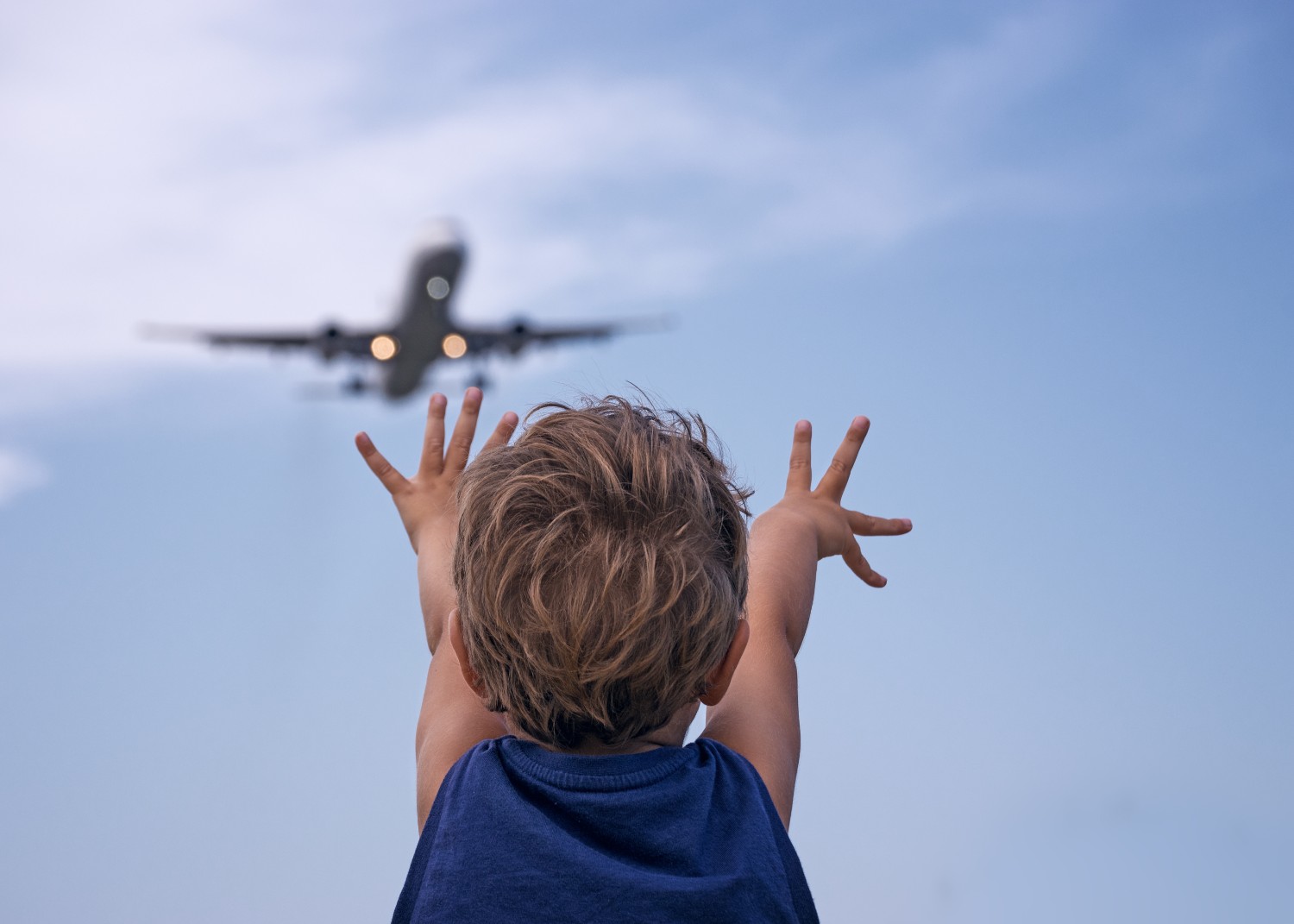 Words of Advice for New Parents, toddler looking at plane
